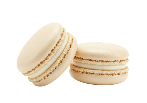 Isolated ivory French macarons filled with cream, a delightful confectionary treat