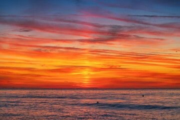 Vivid Sunrise Over Calm Ocean Horizon With Colorful Sky Tropical Sunset