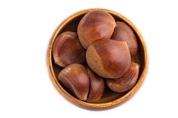 wooden bowl with raw edible Сhestnuts Isolated on white, top view, flat lay, close up, minimalism