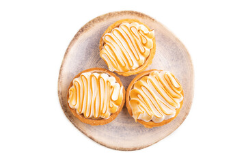 French lemon tart with meringue isolated on white, top view, flat lay, close up