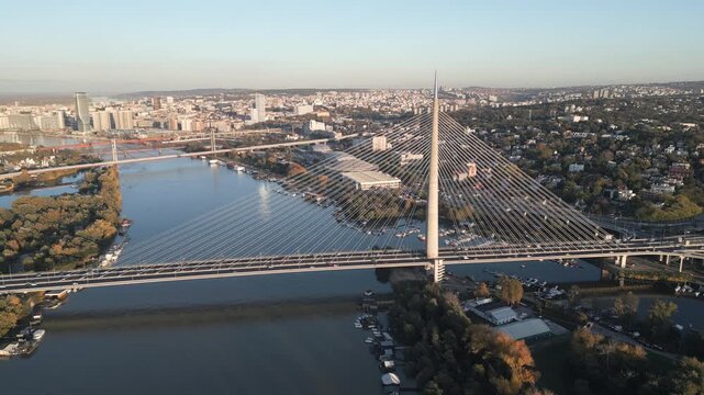 Aerial capture showcase the Ada bridge and Sava river at sunset, Belgrade, Serbia.