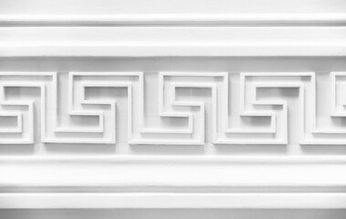 Decoration with white Meander motif. Classic wall moulding, vintage style interior