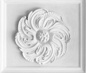 Round white stucco plafond decoration placed in rectangle frame