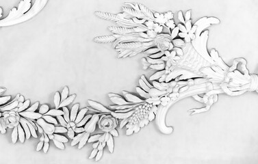 White bas-relief over blank ceiling backdrop. Classic moulding