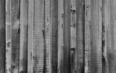 A close-up view of dark gray wooden planks showcasing natural patterns
