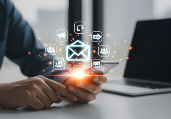 Person using smartphone with digital communication icons overlay