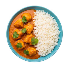 A vibrant overhead view of a dish with creamy orange curry, tender chicken pieces, white rice, and cilantro garnish