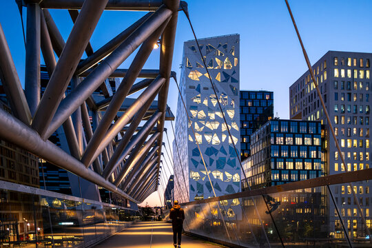 Oslo infrastructure and urban transport at night with illuminated bridge, mobility flow and road motion captured under dynamic architecture lights in modern Scandinavian city