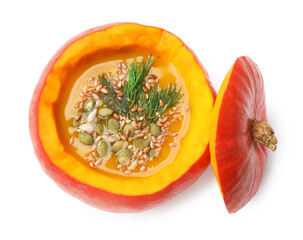 Tasty pumpkin cream soup with seeds and dill isolated on white, above view