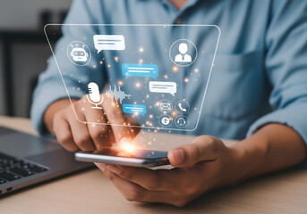 Man using smartphone with holographic social media and communication icons