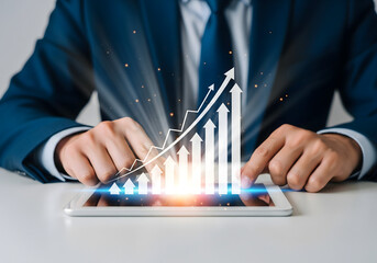 Businessman analyzing growth chart on tablet with digital overlay