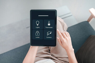 Smart Home Control. User managing devices with tablet interface.