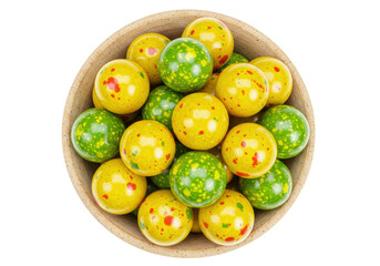 Isolated candies in the bowl, yellow and green sweets close-up view, sweet dessert