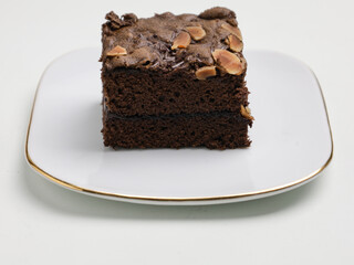 Chocolate cake or chocolate steamed brownie on white background