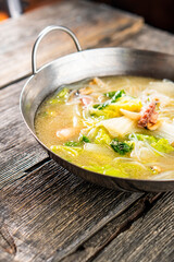 Soup with seafood. Chinese cuisine. Food concepts.Shrimp, mussels, squid, octopus