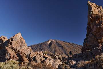 Hiker photographing Teide at Roques de García