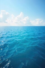 Obraz premium Vast, tranquil ocean stretching to the hazy horizon, a serene seascape perfect for travel or nature themes The calming blue meets the sky in a breathtaking panorama , summer, waves