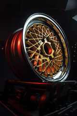 old retro stylish wheels collapsible two-component with a gold center and shiny rims for car tuning long exposure photo to simulate movement