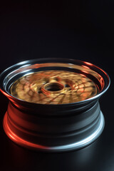 old retro stylish wheels collapsible two-component with a gold center and shiny rims for car tuning long exposure photo to simulate movement