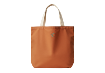 Isolated orange canvas tote bag with cream handles and subtle green leaf design ~87 chars