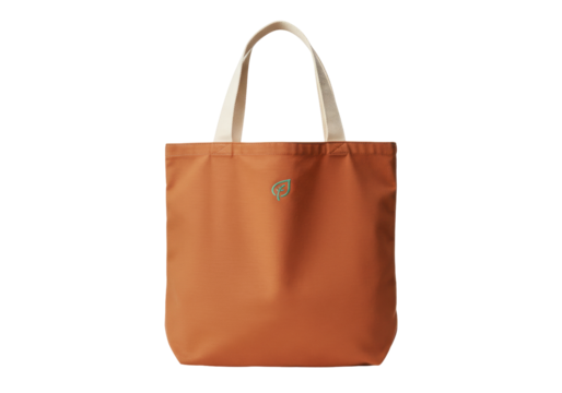 Isolated orange canvas tote bag with cream handles and subtle green leaf design ~87 chars