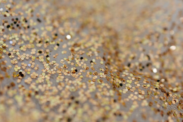 Golden Glitter Bokeh Texture on White Fabric