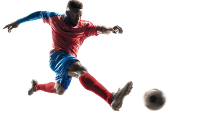 A soccer player kicking a soccer ball showing power action and athletic energy isolated on white background
