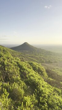 Roseberry Topping during golden hour with setting sun - Great Ayton, North Yorkshire [Portrait Video]