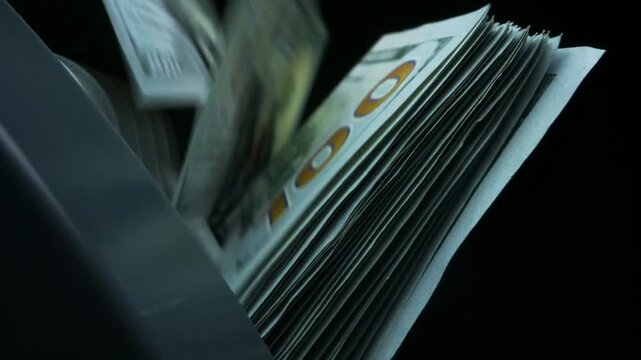 Cash counting process in a dark room with fast movement