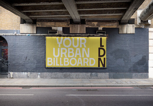 Billboard Design under a bridge stands along a London street