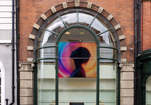 Storefront framed by a large arched window
