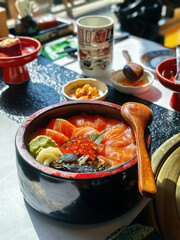 Japanese salmon bowl served with rice, fish eggs, and dry seaweed