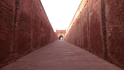 The long walkway with brick walls in Agra Fort (Qila Agra), Agra, Uttar Pradesh, India | UNESCO World Heritage Site	