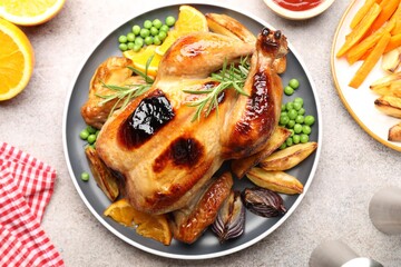 Tasty grilled chicken with rosemary and vegetables on grey table, flat lay