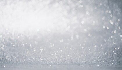 shimmering silver glitter sparkles softly across minimalist winter backdrop creating serene mood with ample copy space perfect for wallpaper design