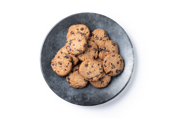 Baked chocolate chip cookies on black plate isolated on white background