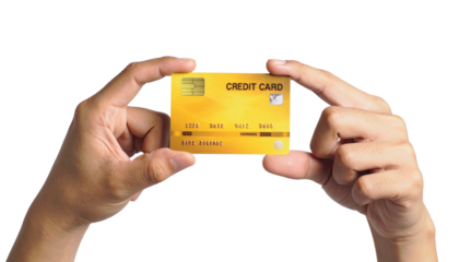 Close-up of hands holding a gold credit card, a symbol of finance and transactions