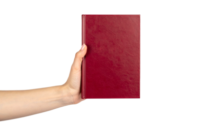A hand holding a red book, perfect for reading or study. The book is presented with its cover facing forward. The scene is simple and clean, highlighting the book and hand