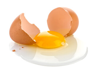 Fresh Broken Eggs with Yellow Yolks and Shells on White Surface