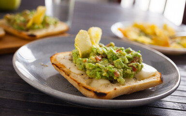 morning toast with melted cheese and guacamol
