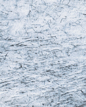 Aerial view of a glacier's icy expanse, etched with dark crevasses and winding meltwater streams, creates a mesmerizing, stark landscape, Heinabergsj&Atilde;&para;kull, Sveitarf&Atilde;&copy;lagi&Atilde;&deg; Hornafj&Atilde;&para;r&Atilde;&deg;ur, Iceland.