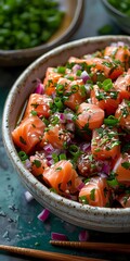 Fresh salmon poke bowl with diced raw fish, red onions, green onions, sesame seeds, and herbs served in ceramic bowl on dark background. Asian cuisine.