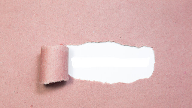 Torn pink paper with a rolled edge, revealing a blank white space, perfect for creative marketing, announcements, and message concepts