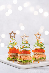 Christmas tree canape with Smoked Salmon, Cream Cheese, Dill, Horseradish Pate and red caviar