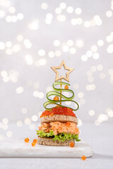 Christmas tree canape with Smoked Salmon, Cream Cheese, Dill, Horseradish Pate and red caviar