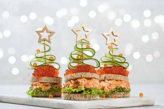 Christmas tree canape with Smoked Salmon, Cream Cheese, Dill, Horseradish Pate and red caviar