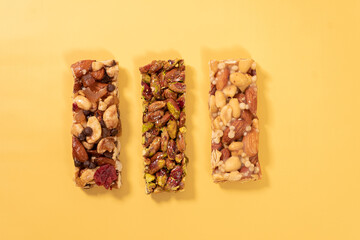 Four different types of snacks are shown, including nuts, raisins, and granola