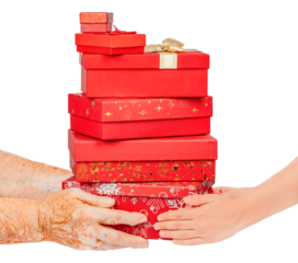 Elderly and young hands holding a stack of red gift boxes decorated for Christmas, isolated on white. Generational giving and holiday sharing concept symbolizing care, family celebration.