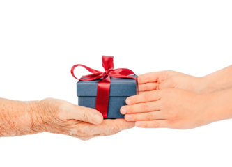 Elderly and young hands exchanging a small blue gift box with a red ribbon, isolated on white. Concept of care, giving, gratitude connection between generations during holidays. special occasions.