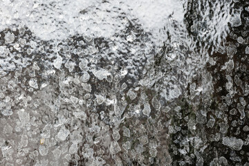Hard water Calcium or lime scale deposit stains on a shower glass window. Close up, macro shot, no people
